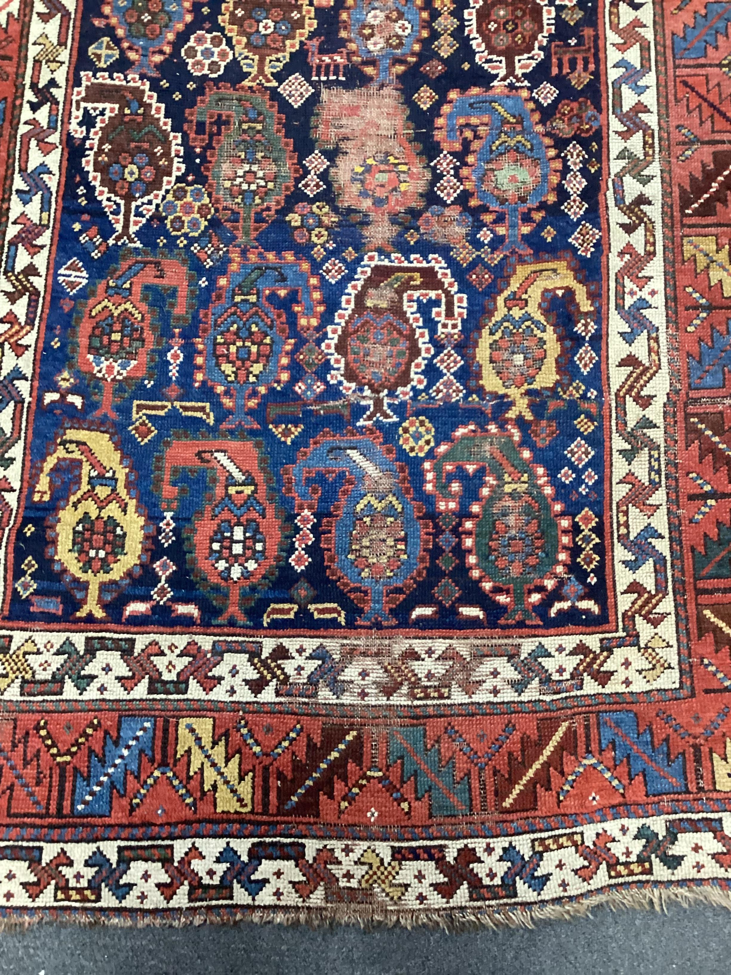 A Caucasian Karabagh runner, the dark indigo field woven with rows of botehs, 330 x 116cm